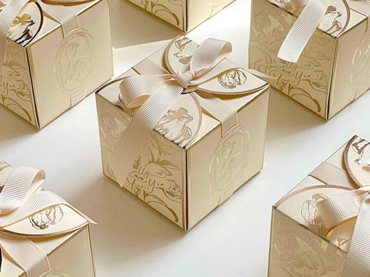 Elegant wedding gift wrapping with ivory and gold accents